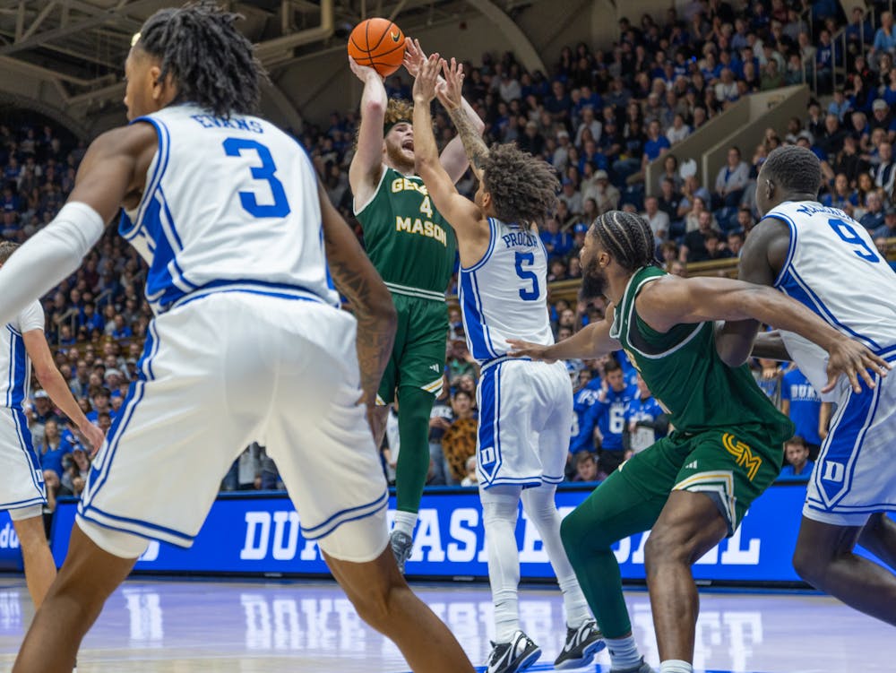 Tyrese Proctor closes out on a shot from Brayden O'Connor.  