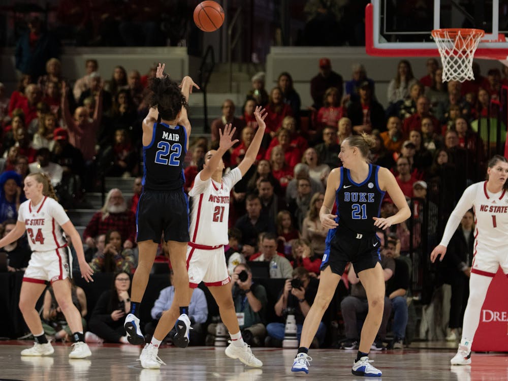 Taina Mair shoots over an N.C. State defender during Duke's loss in Raleigh.