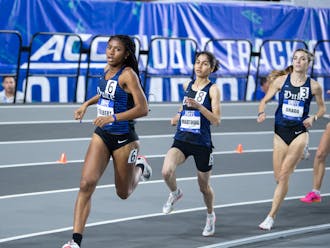 Amina Maatoug (center) finished third in the women's 3000m Saturday.