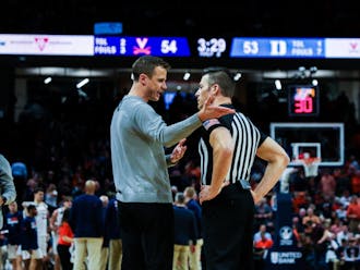 Head coach Jon Scheyer speaks to an official during a timeout late in the second half of Duke's loss to Virginia. 