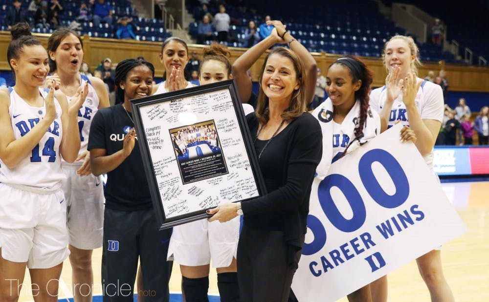 Joanne P. McCallie spoke at a brief postgame ceremony following her 600th career win Friday.