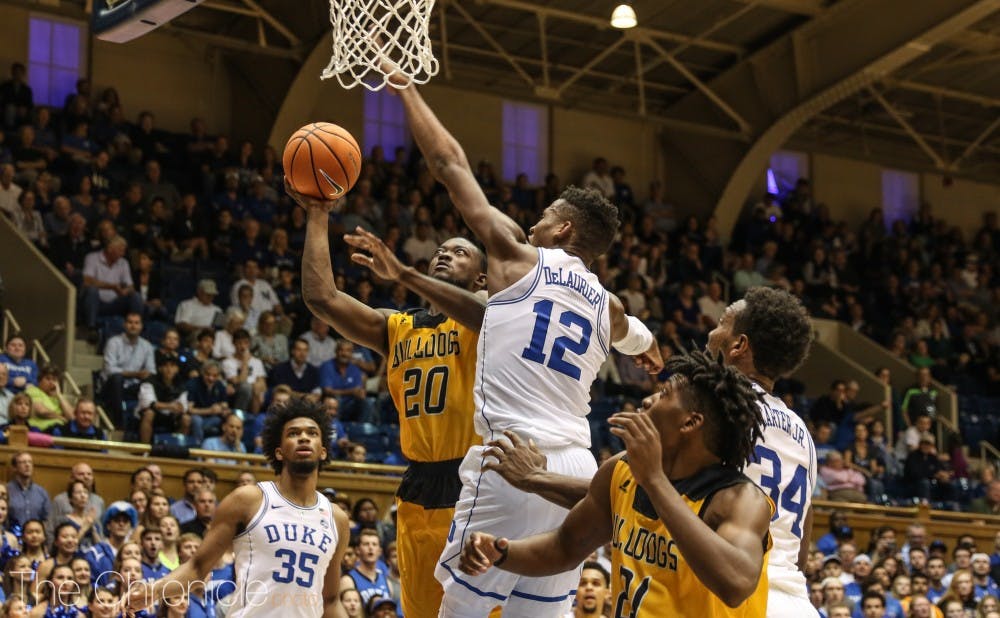 <p>Javin DeLaurier, Marvin Bagley III and Wendell Carter Jr. formed a formidable defensive group on the baseline of a 2-3 zone.</p>
