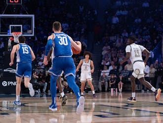 Sophomore center Kyle Filipowski brings up the ball in Duke's loss against Georgia Tech. 