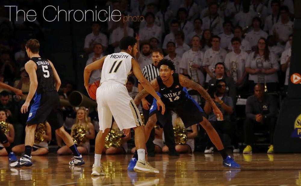 After its zone was burned in the first half, Duke went man-to-man in the second half and pulled away, even without  head coach Mike Krzyzewski.