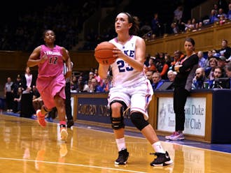 Rebecca Greenwell poured in 25 points and grabbed 12 rebounds, leading Duke to a home victory against Virginia Thursday night.