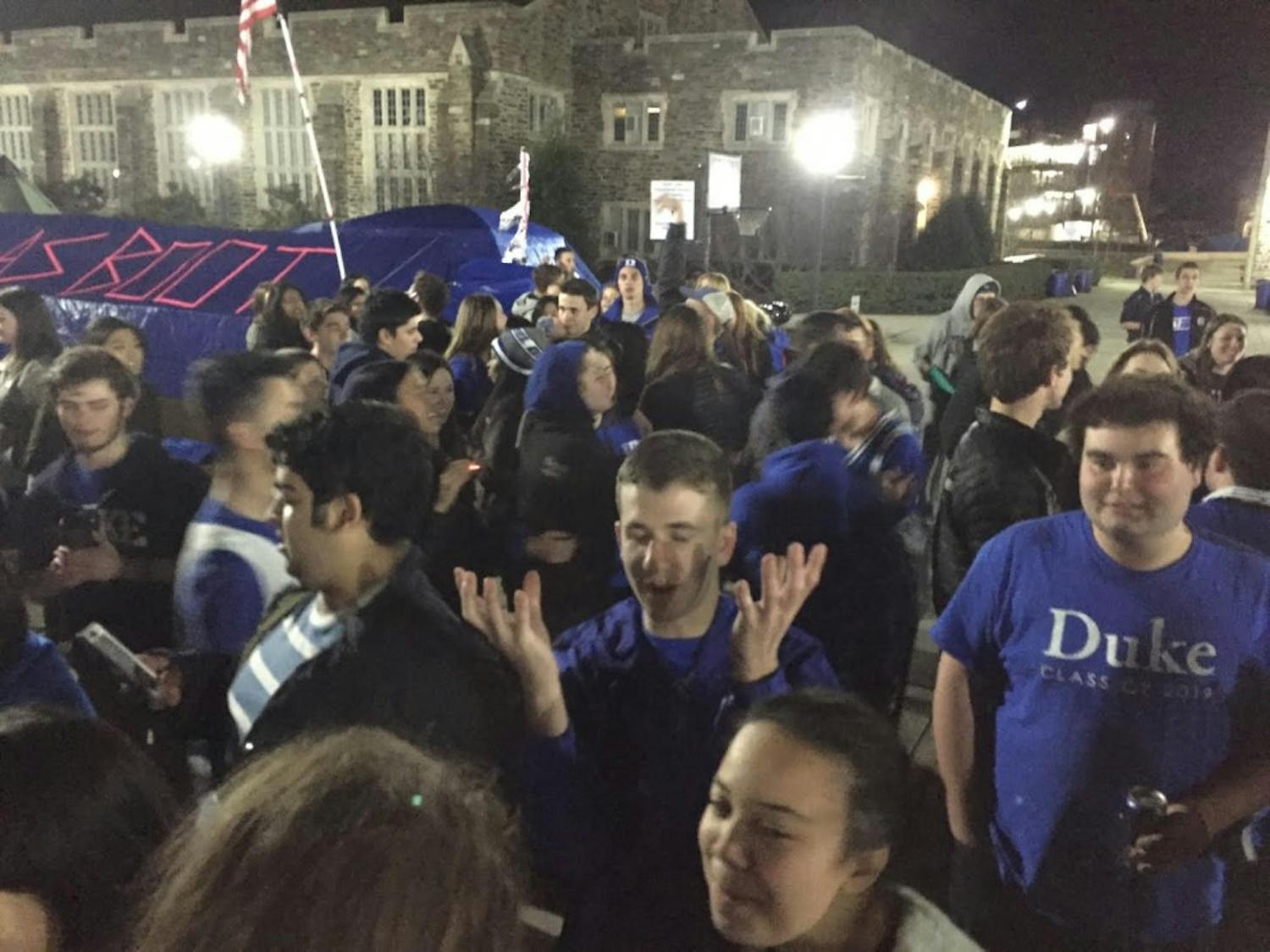 Students waited for the Blue Devils to arrive following their win at Chapel Hill early Thursday morning.