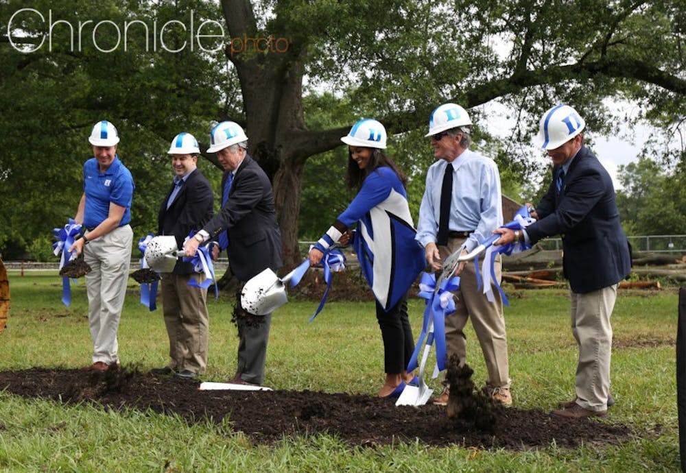 <p>Marissa Young (third from right), Kevin White (third from left) and members of the Duke Athletics staff break ground on Duke Softball Stadium in May 2016.</p>