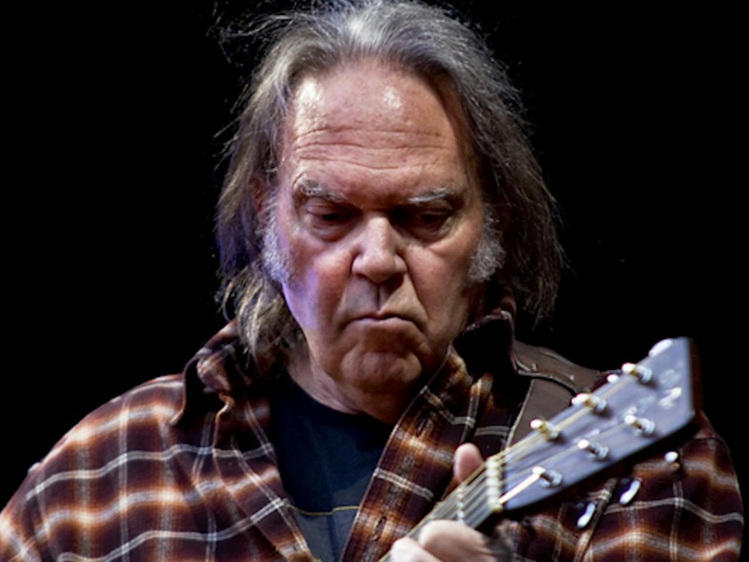"Hitchhiker" consists of 10 tracks of reworked and unreleased material from the folk rock legend, pictured at a concert in 2009.