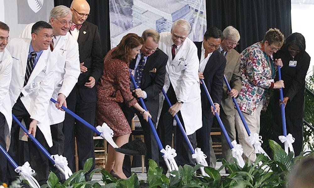 Officials from the state, the University and Duke University Health System participate in a ceremony that symbolizes the ground-breaking of DUHS’ new cancer center Friday afternoon.
