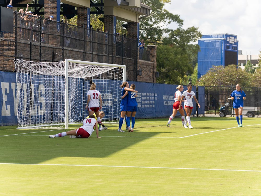 Katie Groff (left) scored the first goal of the match for the Blue Devils.