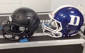 The Duke football team unveiled two new sets of helmets, black and blue ones, this summer. The Blue Devils first wore black uniforms last season.