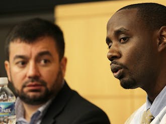 Muslim Chaplain Abdullah Antepli and Rwandan refugee Innocent Justice speak at the 2012 Winter Forum at the Fuqua School of Business.