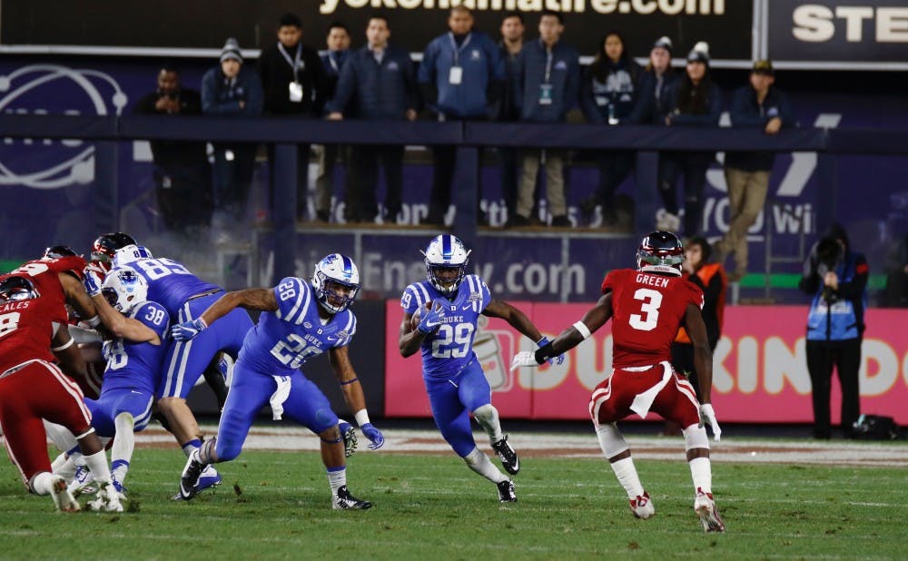 Thanks to excellent blocking, Shaun Wilson went nearly untouched on both of his long touchdown runs to help Duke win the Pinstripe Bowl Saturday.