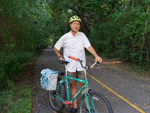John Rees, President of Bicycle Alliance of Chapel Hill, poses with his bike on the Frances Shetley bikeway, which is a part of the 17-mile, shared-use path.