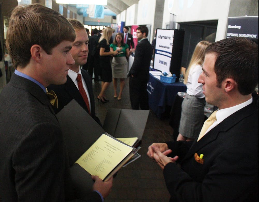 Arthur McCaul and Allen Clark talk with Christian Corts of BB&amp;T at a career exposition held last Spring. University Career Services will host “How to Find an Internship,” a similar event, on Sept. 20 in Hanes Hall. 