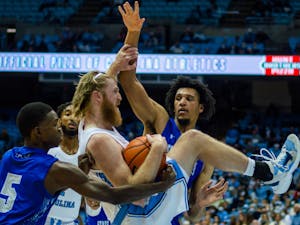 UNC graduate student Brady Manek (45) steals the ball at the exhibition game against Elizabeth City State on Nov 5. at the Dean E. Smith Center.