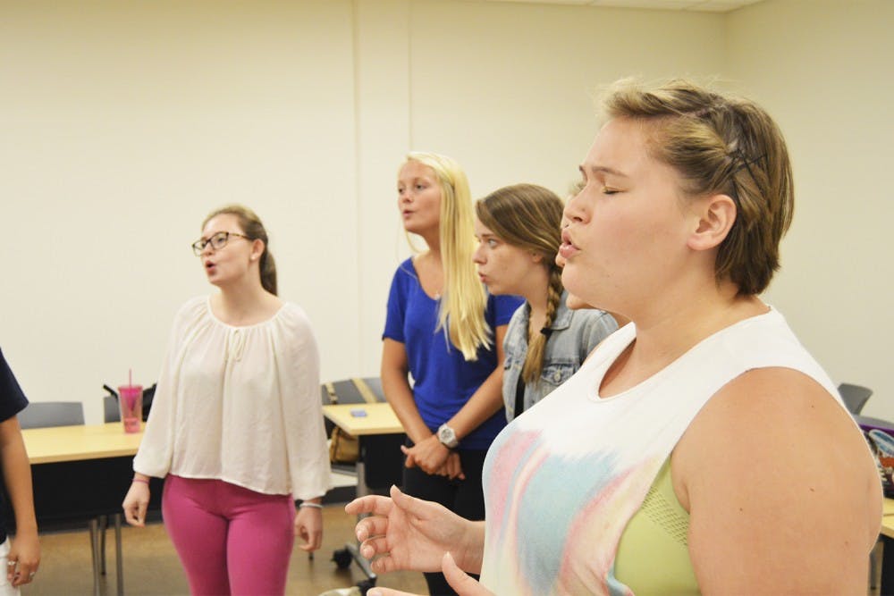 (From right) Valerie Sauer, Susanna Trotter, Taylor Lingle and Katie Arney practice their rendition of "Love Runs Out" by One Republic in preparation for Monday's Sunset Serenade.