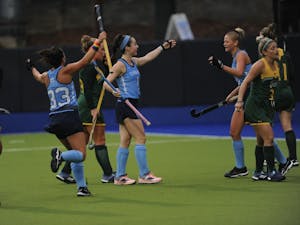UNC's field hockey team celebrates after forward Erin Matson (1) scores the first goal of the match against William and Mary during the first round of the NCAA Tournament in Karen Shelton Stadium Friday. UNC won 4-0 to move on to the second round. Matson, a freshman pre-business major, is a member of the U.S. National Team and played at the 2018 Hockey World Cup.