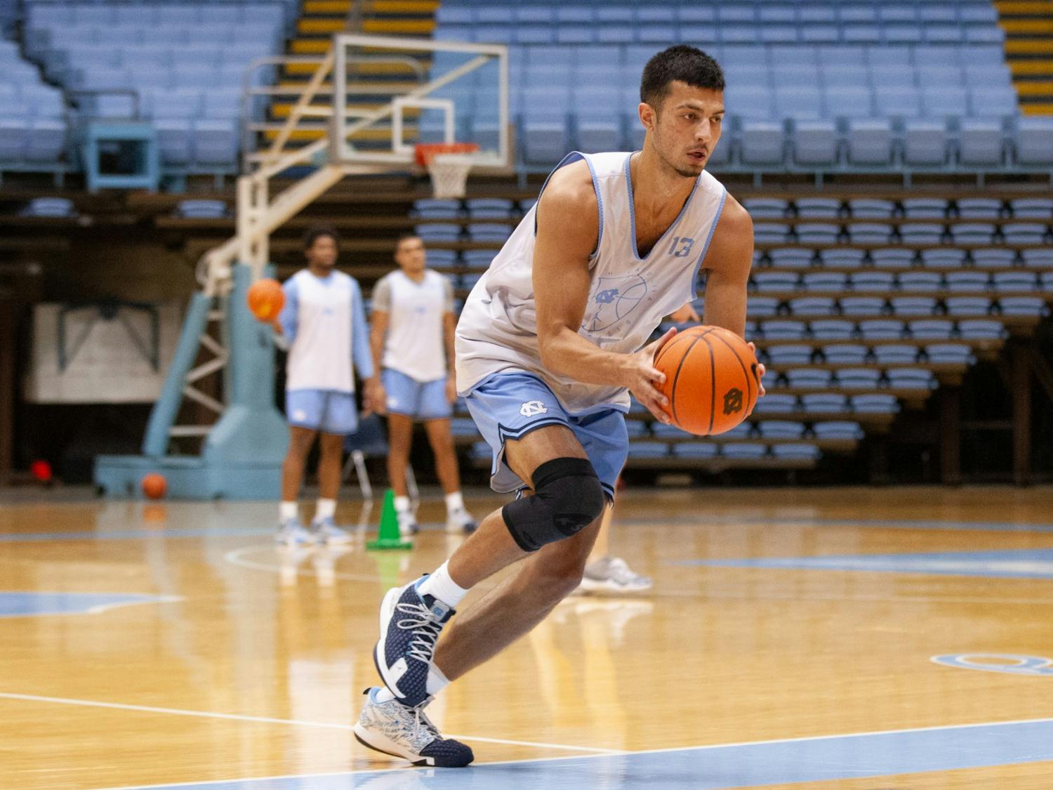 Sophomore forward Dawson Garcia (13) runs with the ball at the UNC men's basketball practice on Sept. 29 at the Dean Dome.