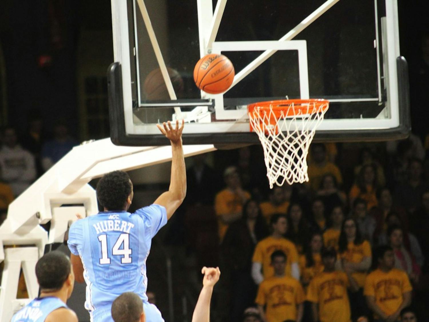 	Desmond Hubert goes for an offensive rebound after a missed shot in the first half.