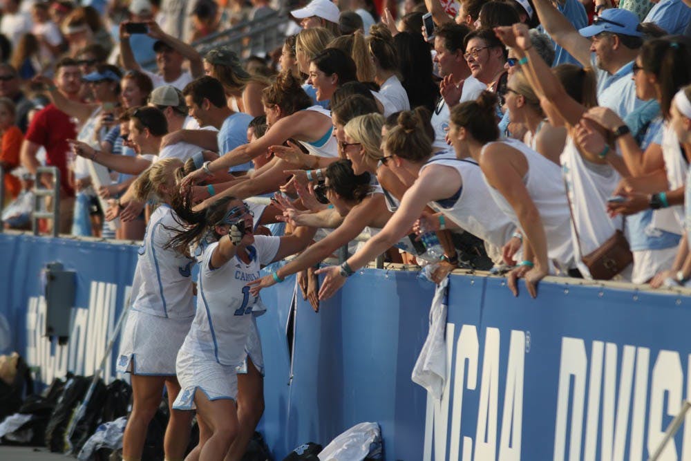 Midfielder&nbsp;Sammy Jo Tracy (13) and her teammates celebrate with the crowd. The UNC women's lacrosse team defeated Penn&nbsp;State 12-11 in the NCAA Tournament semi-finals on Friday at Talen Energy Stadium in Chester, Pa.