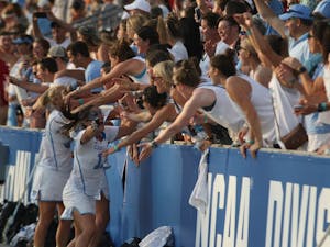 Midfielder&nbsp;Sammy Jo Tracy (13) and her teammates celebrate with the crowd. The UNC women's lacrosse team defeated Penn&nbsp;State 12-11 in the NCAA Tournament semi-finals on Friday at Talen Energy Stadium in Chester, Pa.