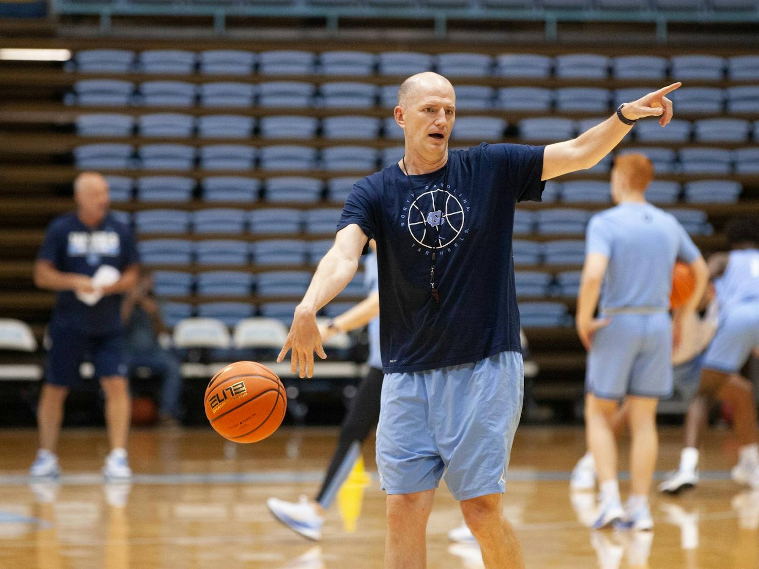 Assistant coach Brad Frederick leads a drill at the UNC men's basketball practice on Sept. 29 at the Dean Dome.