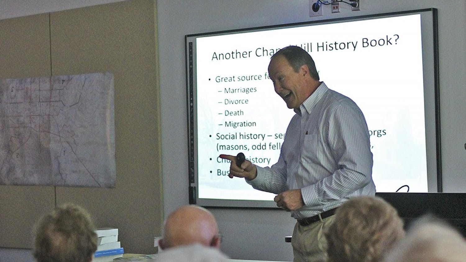 Author Stuart Dunaway presents "A Historical Overview of the Village of Chapel Hill" to a packed room in the Chapel Hill Public Library on Sunday afternoon.