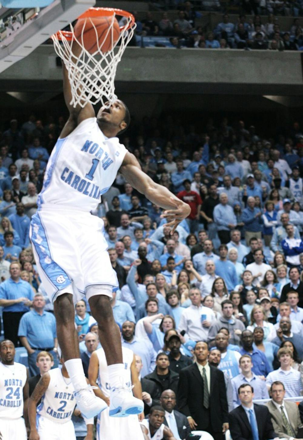 Sophomore Dexter Strickland dunks to earn two of his nine points to cap a late UNC drive that sealed a win against College of Charleston.