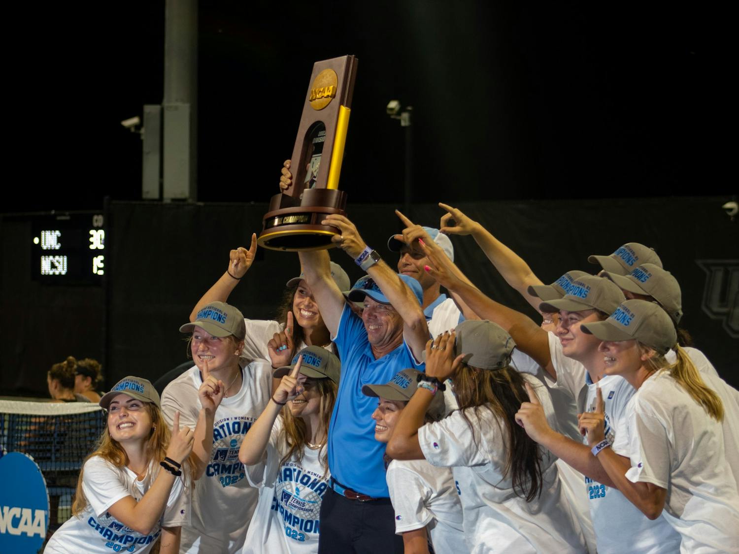 The UNC women's tennis team poses with their trophy after winning the NCAA Tournament on May 20, 2023.&nbsp;