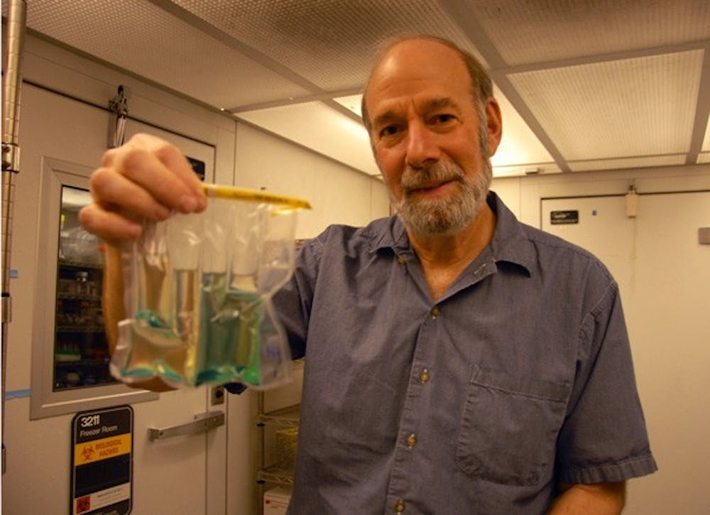 Professor Mark Sobsey holds his invention that he hopes will make testing water quality easier. DTH/ Helen Woolard