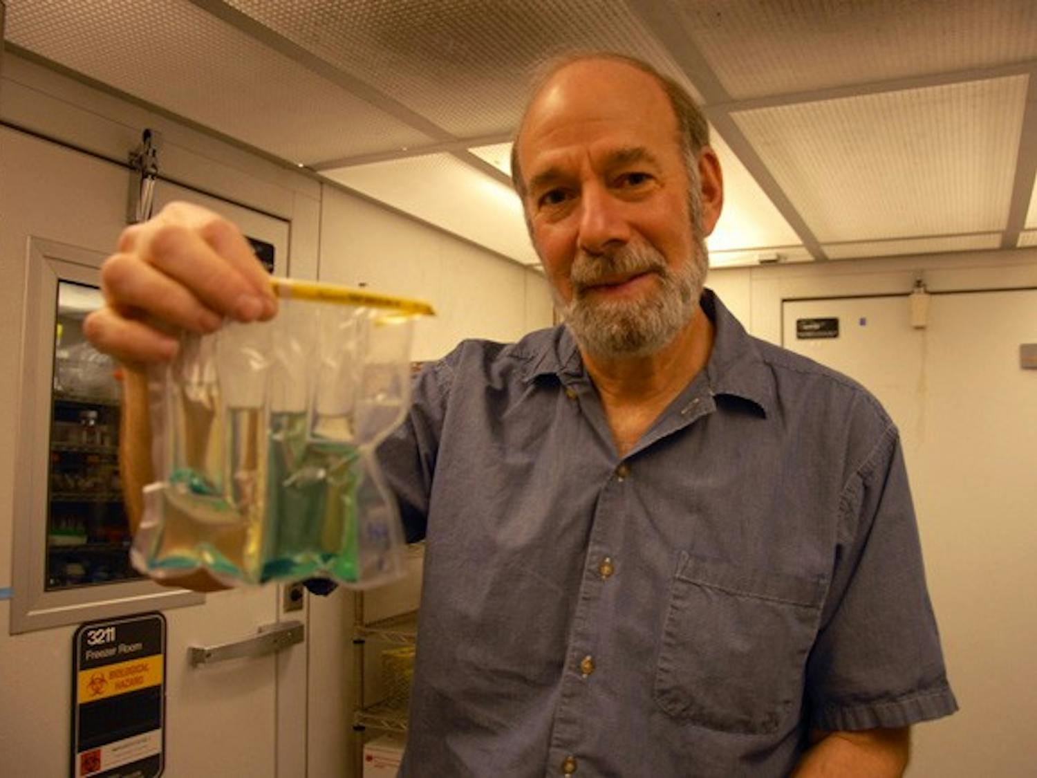 Professor Mark Sobsey holds his invention that he hopes will make testing water quality easier. DTH/ Helen Woolard