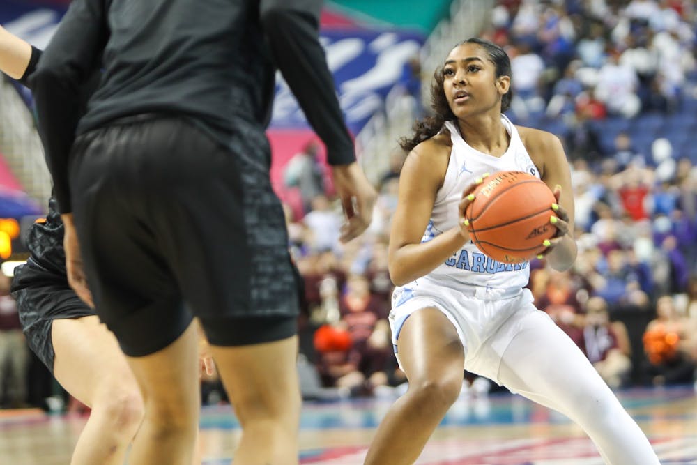 UNC sophomore guard Deja Kelly (25) looks to the basket during the quarterfinals of the ACC Women's Basketball Tournament against Virginia Tech at the Greensboro Coliseum. Virginia Tech won 87-80 in overtime.