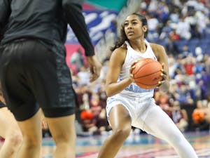 UNC sophomore guard Deja Kelly (25) looks to the basket during the quarterfinals of the ACC Women's Basketball Tournament against Virginia Tech at the Greensboro Coliseum. Virginia Tech won 87-80 in overtime.