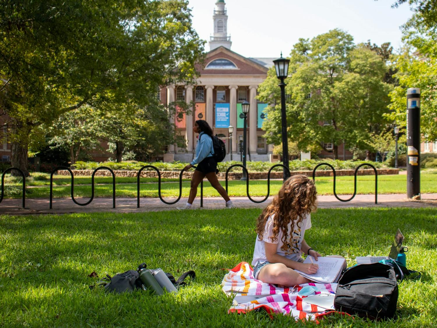 A student studies on the quad near Carroll Hall while adhering to social distancing guidelines on Tuesday, Sept. 15, 2020.