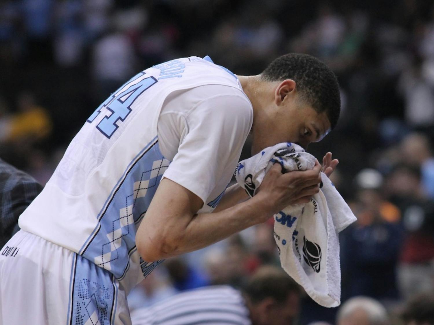 UNC freshman Justin Jackson (44) gets a bloody nose during Saturday's game.  The Tar Heels defeated the Arkansas Razorbacks, 87-78, on Saturday in Jacksonville, Fla.