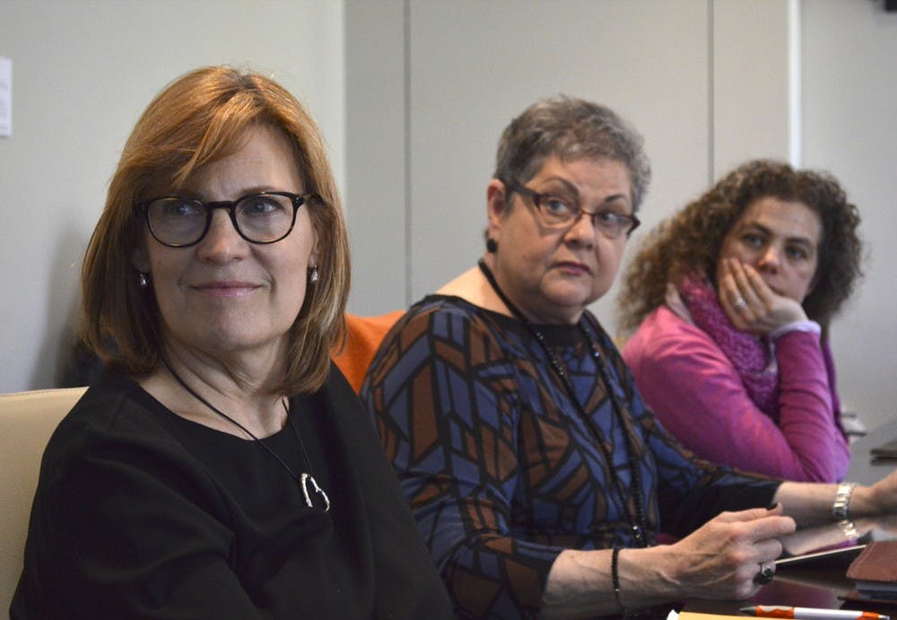 Dr. Mimi Chapman, Dr. Rosa Perelmuter, and Dr. Valérie Pruvost listen attentively at the Faculty Executive Committee meeting Monday, where the committee discussed a variety of issues, including Margaret Spellings protests.