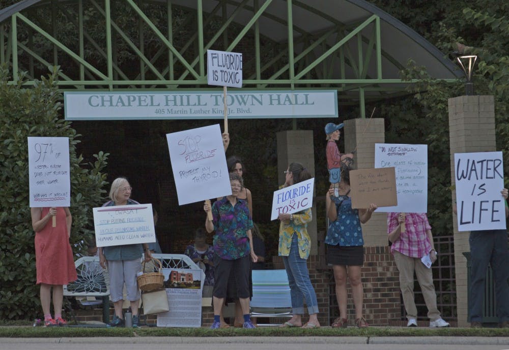 A number of local activists took to the sidewalks outside of Chapel Hill Town Hall on the evening of Thursday, August 24th, to protest the OWASA board's continued fluoridation of Orange County water sources.