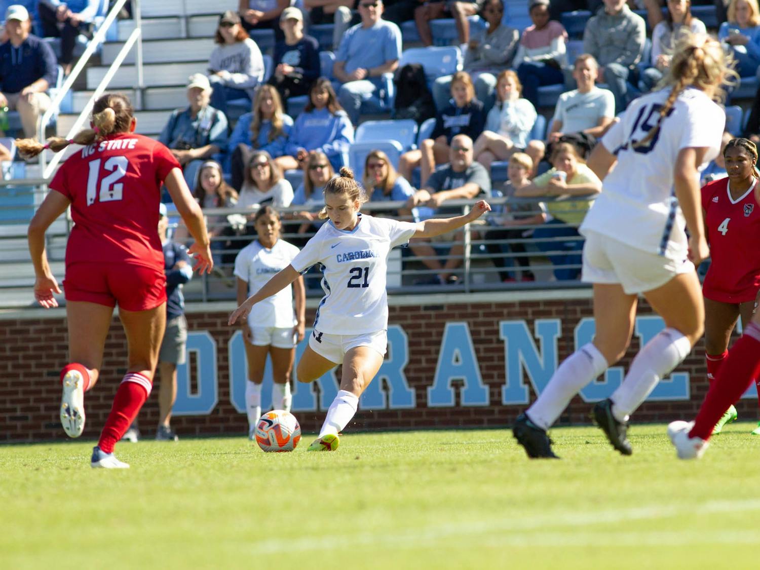 UNC freshman forward Ally Sentnor (21) takes a shot during the women's soccer game against NC State on Sunday, Oct. 9, 2022, at Dorrance Field. UNC beat NC State 2-0.