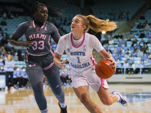 Sophomore guard Alyssa Ustby (1) looks to take a lay-up at a game against Miami on Sunday, Feb. 6, 2022, in Carmichael Arena. 