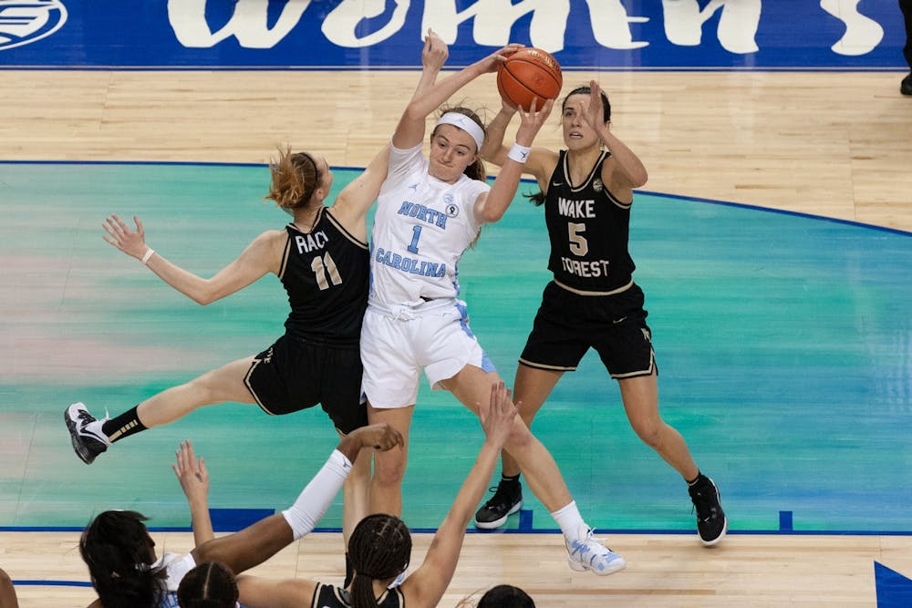 UNC first year forward Alyssa Utsby pulls down a rebound in Carolina's second-round game against Wake Forest University at Greensboro Coliseum on Mar. 4, 2021.