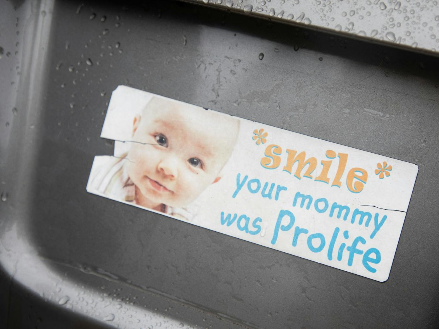 A bumper sticker on a pro-life supporter's car reads, "Smile, your mommy was prolife" on Saturday, Oct. 1, 2022.