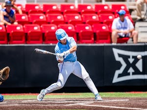 UNC first-year catcher Tomas Frick (52) hits the ball at the NCAA tournament game against UCLA on Sunday June 6, 2021 in Lubbock, TX. The Tar Heels lost 2-12. Photo courtesy of Elise Bressler. 