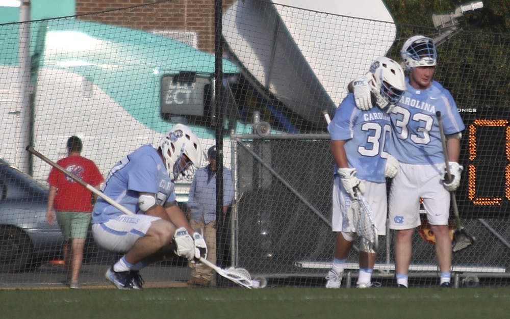 The North Carolina men's lacrosse team shows emotion after losing to No.1 Syracuse 12-11&nbsp;in overtime on Saturday.