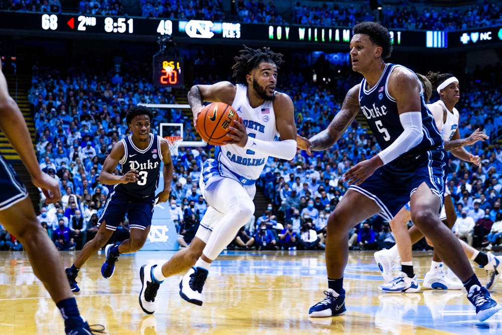 <p>Sophomore guard RJ Davis (4) drives to the basket in the Dean Smith Center during the UNC men’s basketball game on Saturday, Feb. 5, 2022. Duke won 87-67.</p>