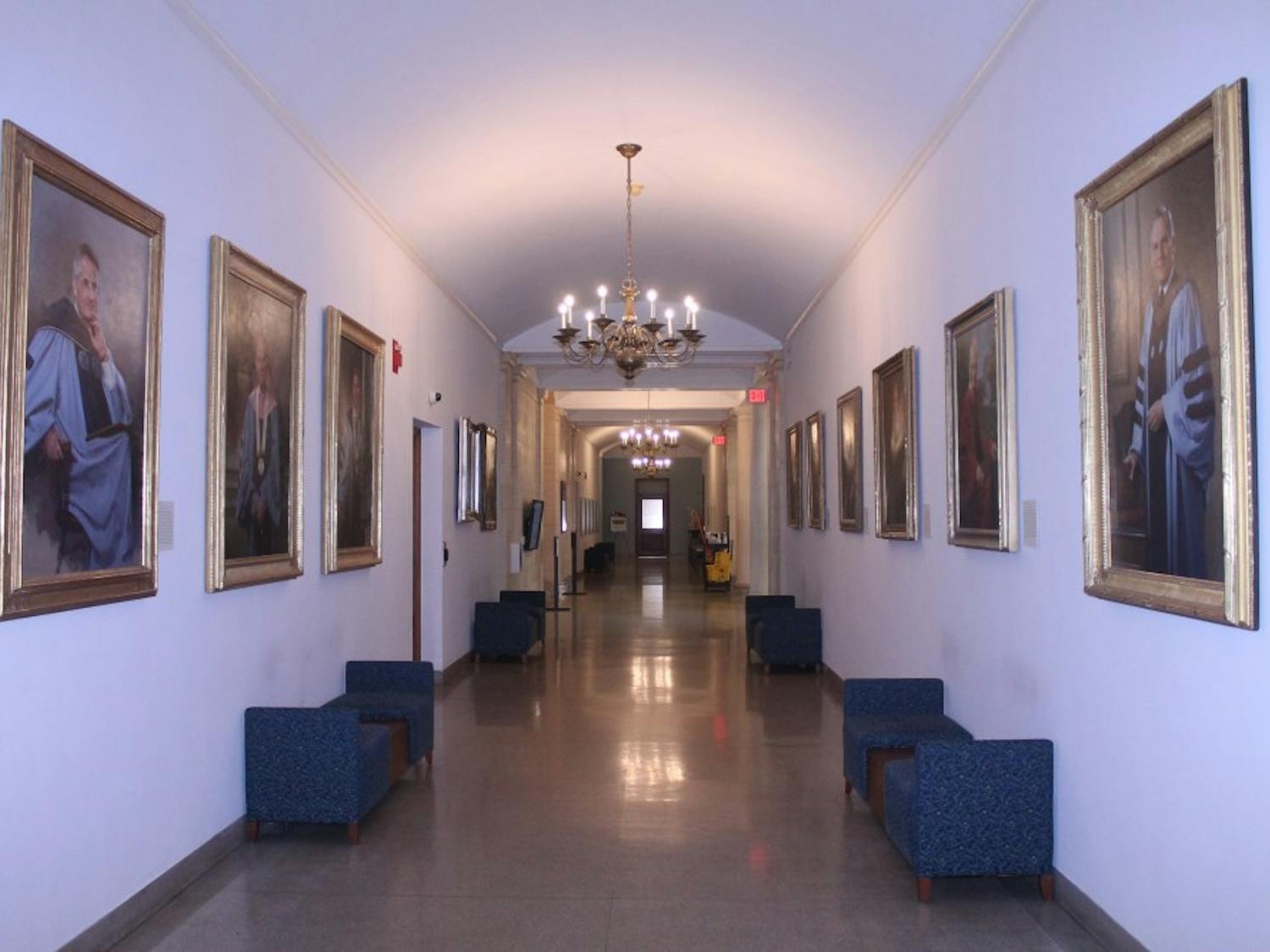 Portraits of former UNC chancellors line the walls of Wilson Library on the campus of the University of North Carolina at Chapel Hill.&nbsp;
