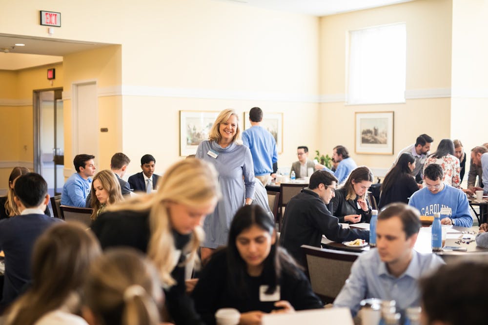 <p>UNC Professor Karin Cochran works with STAR students at an event on Jan. 20, 2023. Photo Courtesy of Allison Adams.</p>