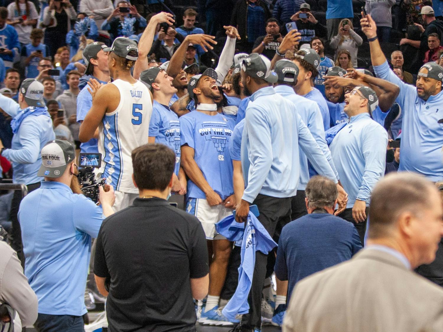 The UNC Men's Basketball Team celebrates after beating St. Peter's in the Elite 8 game of the NCAA tournament &nbsp;at the Wells Fargo Center in Philadelphia. UNC won 69-49 and advanced to the Final Four. &nbsp;