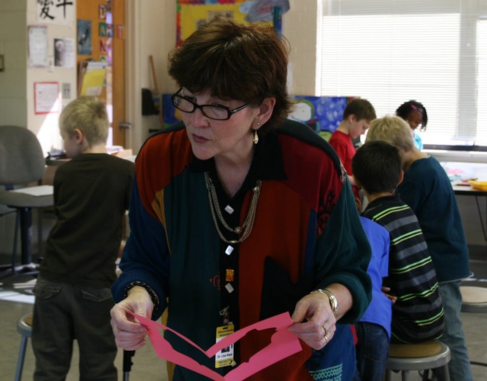 Dr. Lisa Napp, principal of Efland-Cheeks Elementary School, talks with an art class on Monday. Dr. Napp was selected as Orange County’s 2011 Principal of the Year and will now advance to further competition.