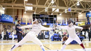 UNC's Sydney Persing fences with Boston College's Vivian Li during the women's fencing match in Card Gym at Duke University on Sunday, Feb. 10, 2018.